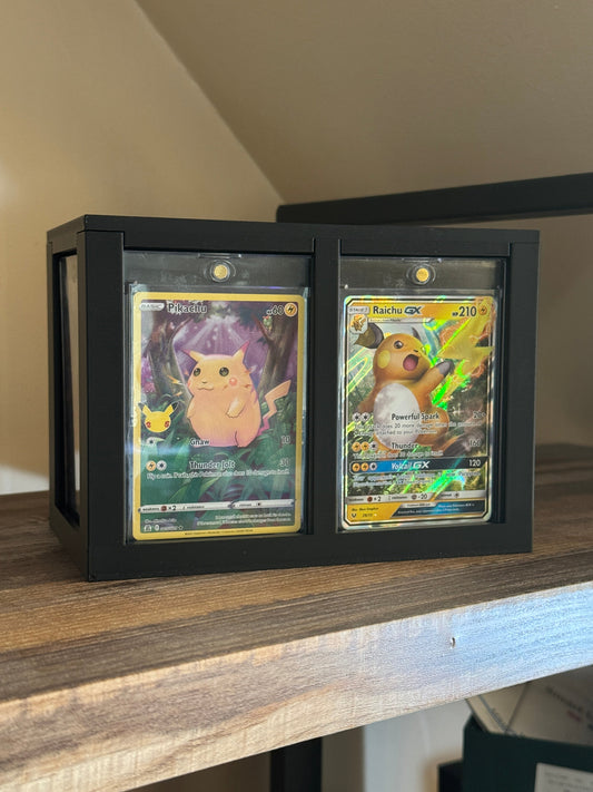 Pokemon cards in one touch cases displayed on a shelf storage box