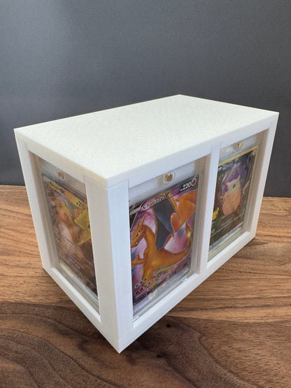 White One Touch Station magnetic case display box with Charizard V and Pikachu Pokemon cards