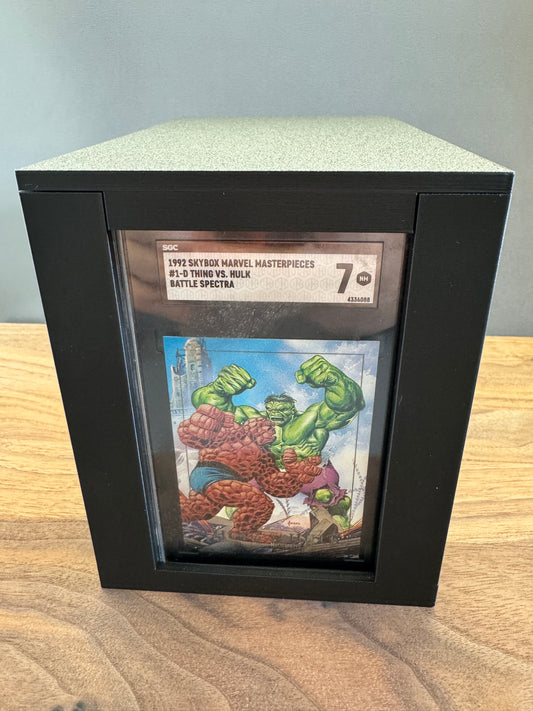 Front view of the SGC Slab Station showing an SGC graded Marvel card