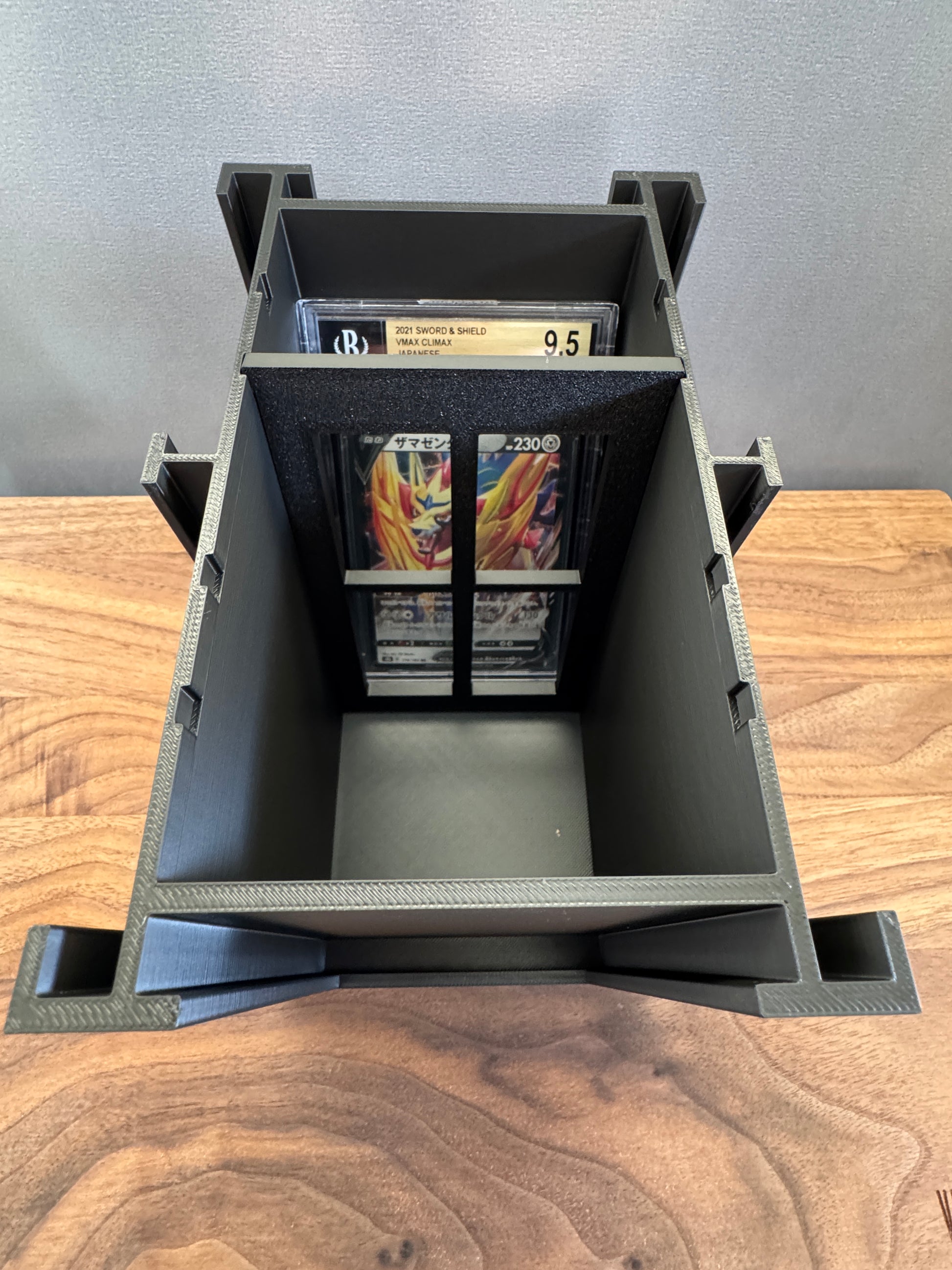 Top view inside the BGS Slab Station with a Beckett graded Pokemon slab