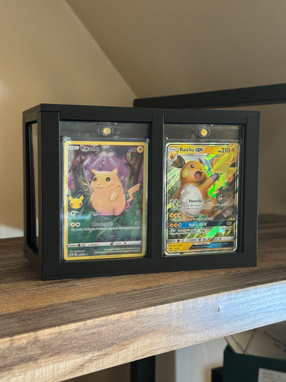 One Touch Station on a shelf displaying Pikachu and Raichu GX Pokemon cards in one touch cases