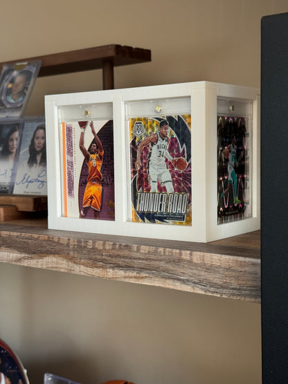 White One Touch Station displaying Kobe Bryant and Giannis basketball cards in magnetic cases