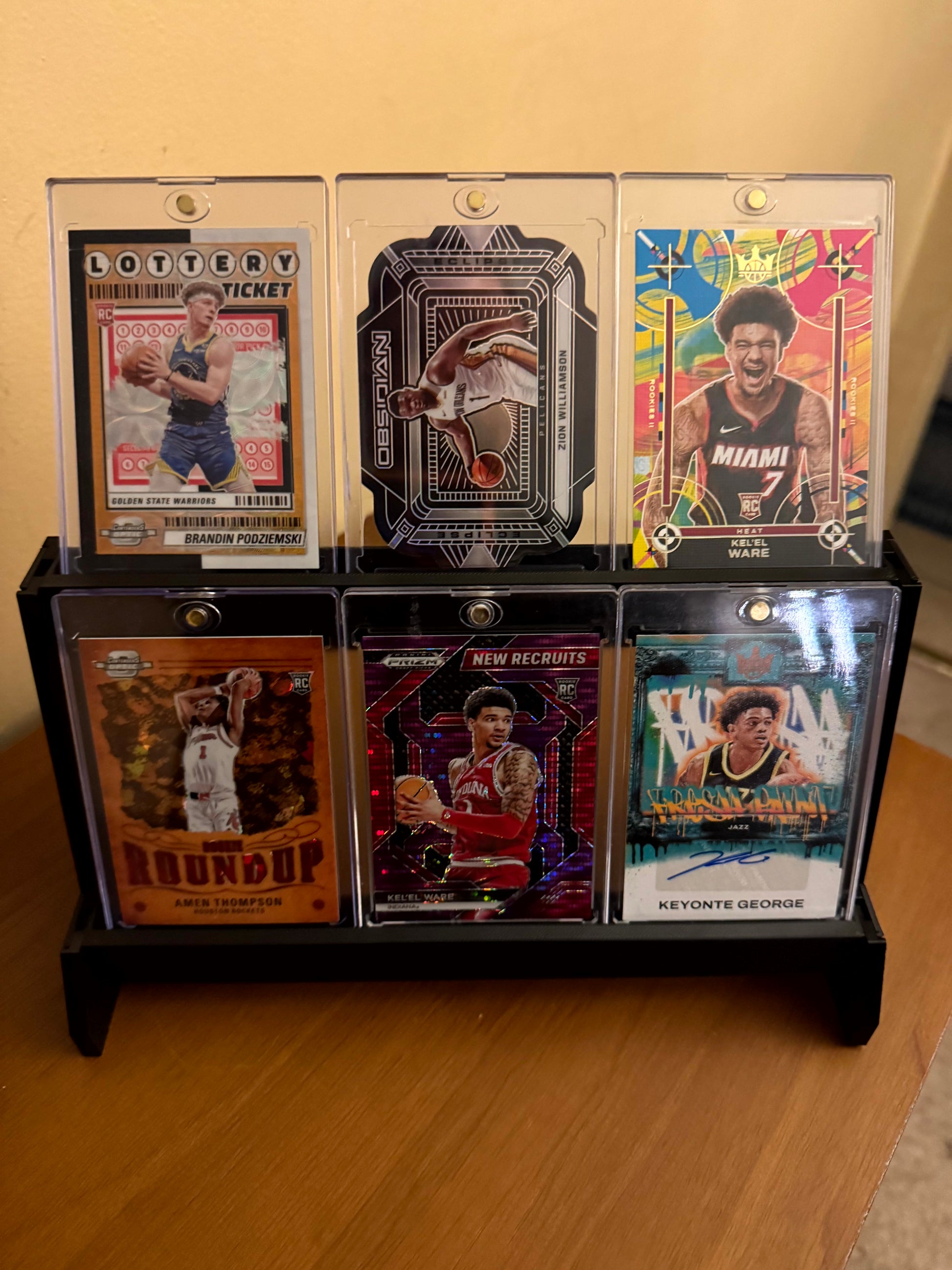One Touch magnetic case tiered stadium display holding six cases - product photo 4