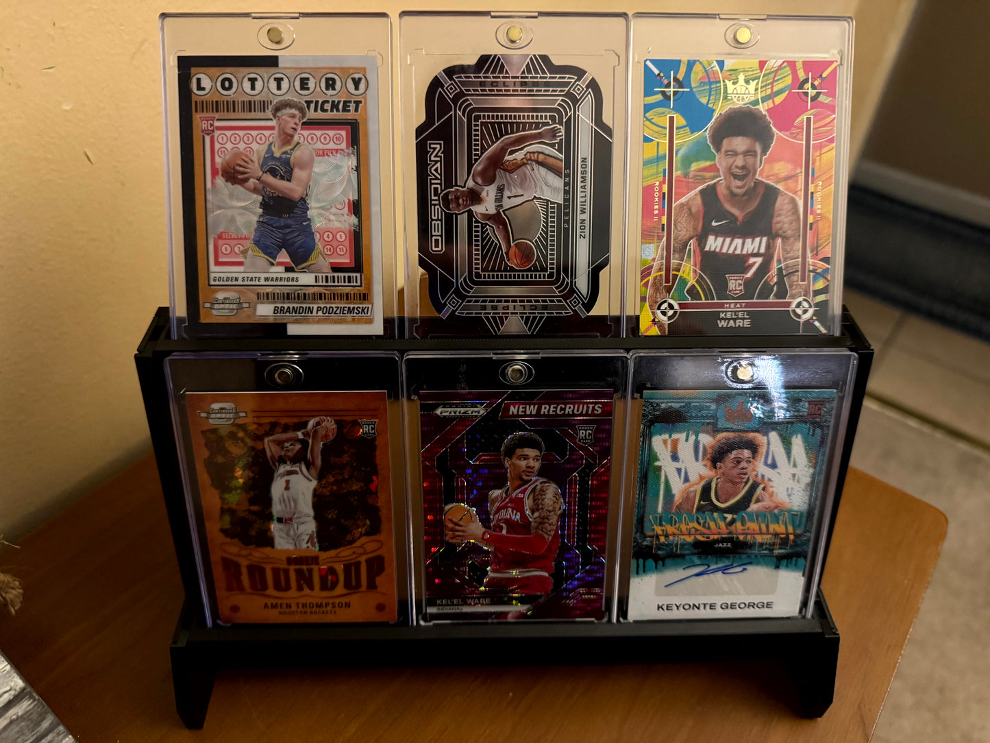 One Touch magnetic case tiered stadium display holding six cases - product photo 3