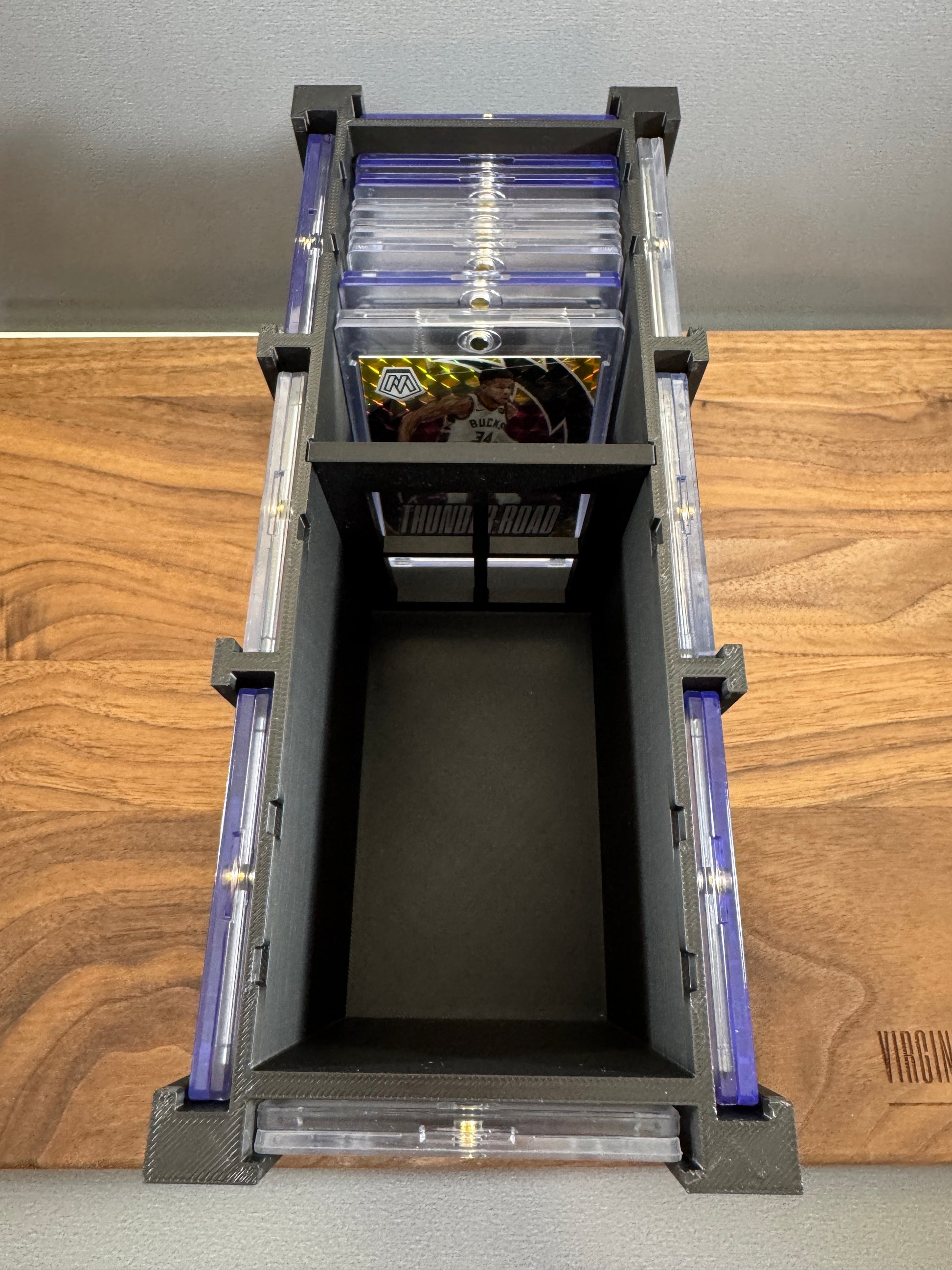 Top view inside the One Touch Station Large storing magnetic one touch cases upright in rows