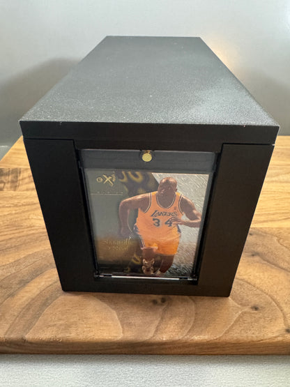 Front end of the black 180pt One Touch display box with lid on, showing a basketball card in a thick magnetic One Touch case